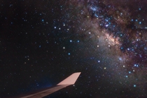 Bright stars of Sagittarius and the center of our Milky Way Galaxy lie just off the wing of a Boeing  