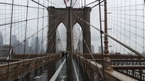 Brooklyn Bridge heading toward Manhattan on a chilly and rainy day in October  INY