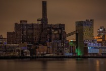 Brooklyns abandoned Domino Sugar Factory at night shot from across the East River 