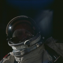 Buzz Aldrins self-portrait during Gemini  with the Earth reflecting off his visor  November  