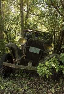 Car on the side of a river bank