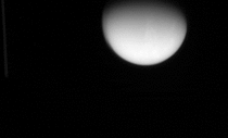 Cassini captured Titan setting behind Saturn