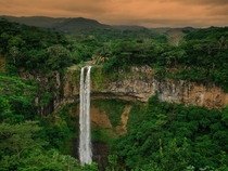 Chamarel Falls as it cascades more than  feet into a lush gorge Mauritius  by Victoria Komarevych 