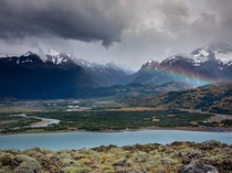 Changing weather created a rainbow in a beautiful valley in Torres del Paine Chile OC x
