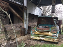 Chevy dump truck in front of abandoned cotton gin Walburg Texas  