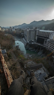 chilling on the roof at an abandoned hotel in japan