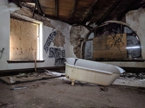 Clawfoot tub inside an abandoned New England mansion