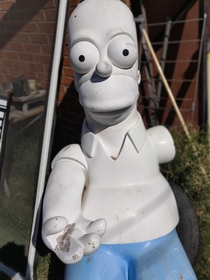 Cleaning a house from a tenant that was evicted She had abandoned her life sized Homer Simpson