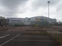 Closed Toys R Us store and car park