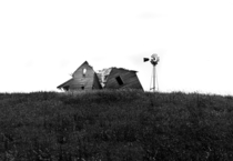 Closer-up view of abandoned South Dakota farmhouse 