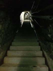 Connection tunnel of one of our local artillery fortificationsmaintenance and living level to high level cannon bunkersabandonded in the nineties but still fully functional Imagine getting up for your  hour shift an going up  steps with your gear after br