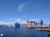 Container Ship MOL PARTNER starting up her engines as tugs pull her away from the terminal dock at the Port of Seattle 