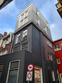 Contrasting architectural style of this penthouse compared to lower floors Koude Gat Groningen 
