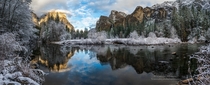 Cool and refreshing a snow storm blows through Yosemite leaving the valley dusted in a white powder El Capitan and Bridal Veil the guardians of the Valley reflect in the smooth still waters of the Merced River  by Darvin Atkeson 