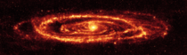 Cosmic dust of the Andromeda galaxy as revealed in infrared light by the Spitzer Space Telescope  NASAJPL