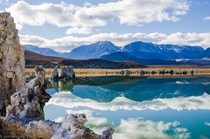 Crazy reflections of Mono Lakes tufas towers and the Sierra Nevada mountains in California 