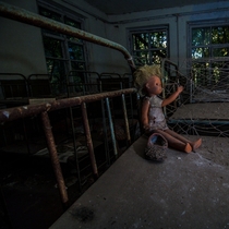 Creepy doll in abandoned kindergarten Kopachi village in Chernobyl exclusion zone 