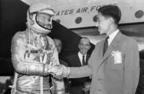 Crown Prince Akihito of Japan shakes hands with astronaut L Gordon Cooper at Langley Field Virginia September  