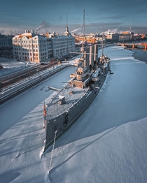 Cruiser Aurora a th century warship that served during the Russo-Japanese War docked on the Bolshaya Nevka river flowing through Saint Petersburg Russia