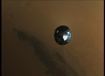 Curiositys heatshield falling to the martian surface seconds after detaching  NASA picture
