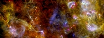 Cygnus-X star-formation region by Herschelnetworks of dust and gas lead to star formation The image combines far-infrared data acquired at  micron blue channel  micron green channel and  micron red channel 
