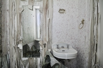 Decaying Bathroom Inside an Abandoned Mansion in Toronto Ontario 