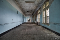 Decaying Corridor Inside an Abandoned State Hospital in NY 