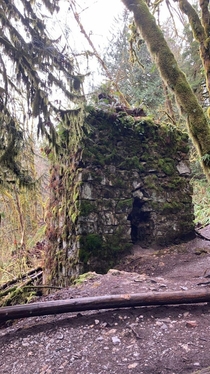 Decrepit remains of a late s smelting kiln abandoned deep in the woods of the PNW This kiln is the last remaining structure of an old limestone mining settlement 