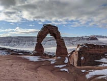 Delicate Arch with snow at Arches National Park UT 