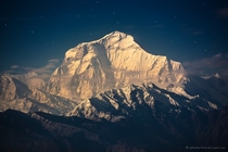 Dhaulagiri the Earths th highest mountain in the light of the rising moon Nepal 