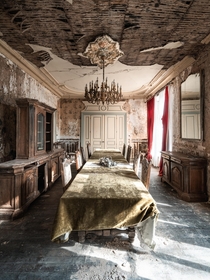 Dining room inside an abandoned th-century castle 
