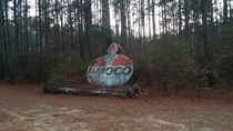 Discarded Amoco station sign found in woods behind functioning BP station St Pauls NC 