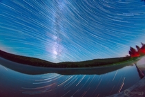 Distorted Star Trails and Milky Way composite I did over Spruce Knob Lake WV with a fisheye 