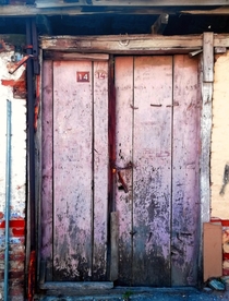 Door of a abandoned house in the middle of the city