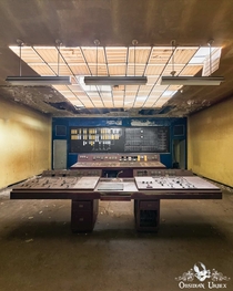 Dusty control room in an abandoned Blegium steel industrial complex 