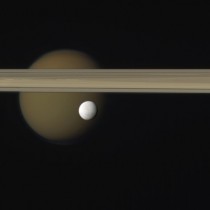 Enceladus Titan and Saturns rings Composite picture via Casini March   