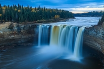 Enterprise Falls as the sun sets in the Northwest Territories Canada 
