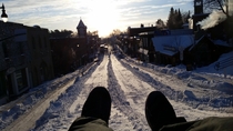 Every year my town turns the hill on the main street into a tube run for a day in January Muskoka Canada
