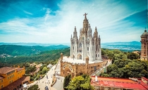 Expiatory Church of the Sacred Heart of Jesus - Barcelona Spain - Built from  to  by Spanish architect Enric Sagnier - The appearance of the church is of a Romanesque fortress of stone from Montjuc the crypt topped by a monumental Neo-Gothic church access