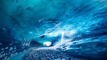 Exploring Ice Caves on Breiamerkurjkull Glacier Iceland 