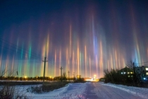 Extremely Rare Light Pillars in Russia dazzling optical phenomenon caused when light is refracted by ice crystals These pillars tend to take on the color of the surrounding light source