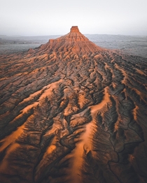 Factory Butte is one of Utahs extremely diverse and beautiful landscapes Best seen from the air  OC insta erik_young