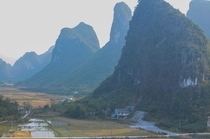 Farms under the karst mountains of Yangshuo Guilin China 