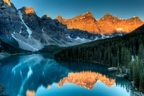 First light kisses the mountains around Moraine Lake 