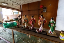 Five Geisha dolls found on a display case in an abandoned Japanese coastal hotel chrisluckhardt