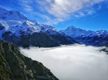 Fog started rolling in and now it looks like a lake made out of clouds - Sealy Tarns Track Mount Cook National Park in New Zealand - 