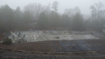 Foggy day at abandoned Olympic-size swimming pool in rural South Carolina  Album in comments