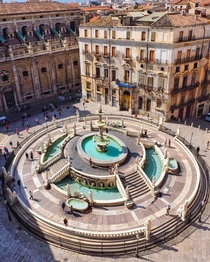 Fontana Pretoria a th century monumental fountain in the historic centre of Palermo surrounded by a th century Baroque church and a th century palace Sicily southern Italy