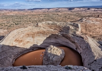 From the top of the rim wall surrounding the Cosmic Navel Garfield Utah US by John Fowler 