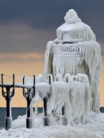Frozen spray St Joseph North Pier Outer Lighthouse on Lake Michigan 